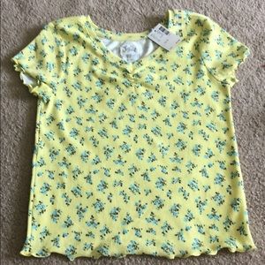 A yellow shirt with blue flowers no stains